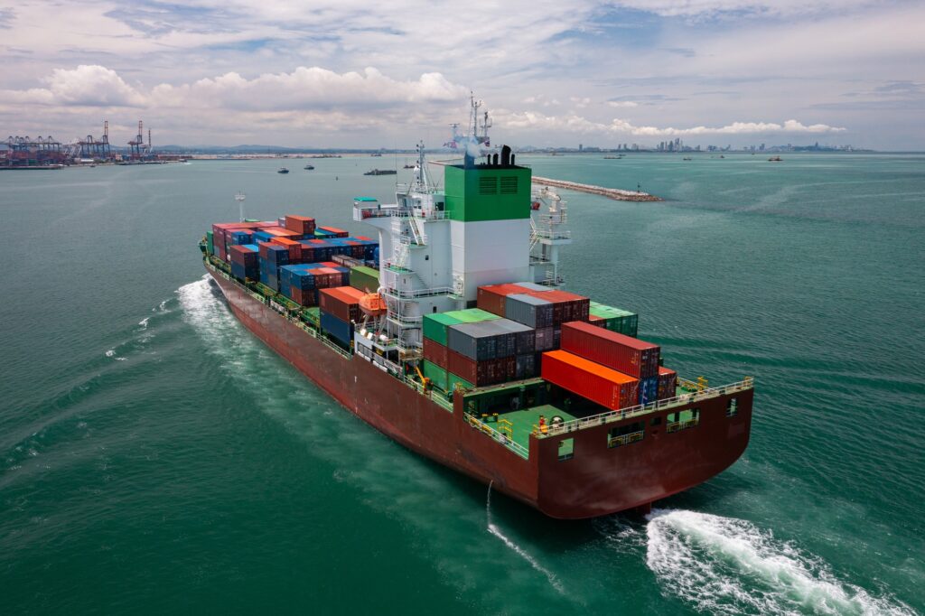 Cargo Ship Entering Busy Container Port
