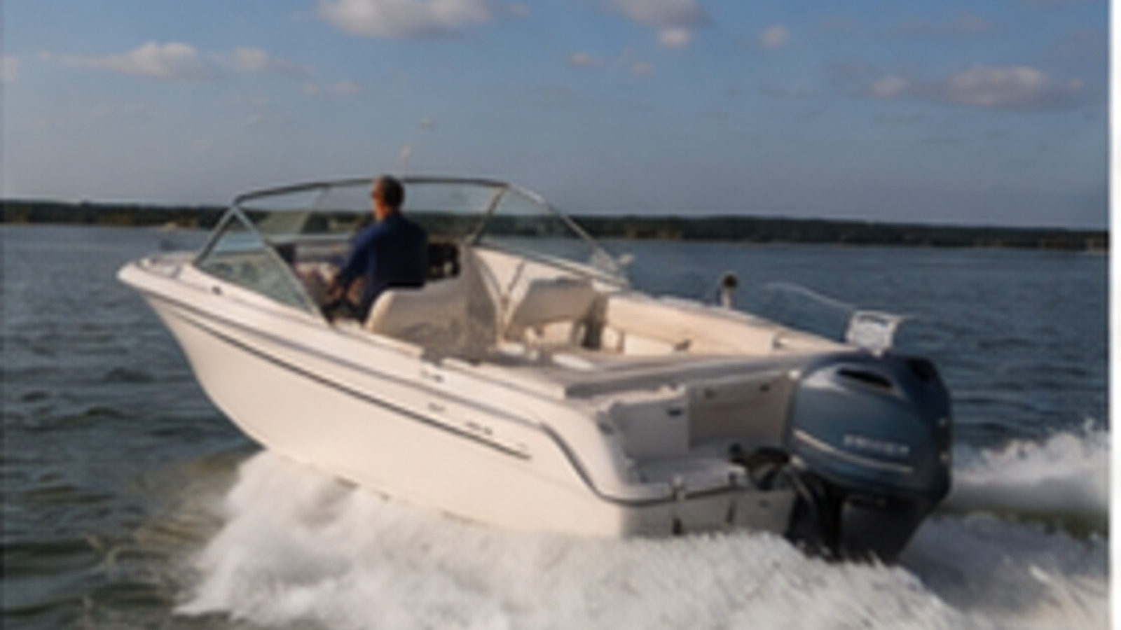 grady white freedom series freedom 215 rear quarter running 03